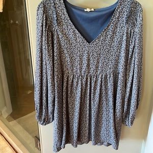 Blue floral tunic with long sleeves and lining.